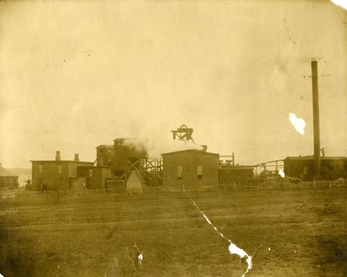 A sepia-coloured photograph of the buildings of Caledonia Number 4 colliery in Glace Bay, circa 1900 to 1920.