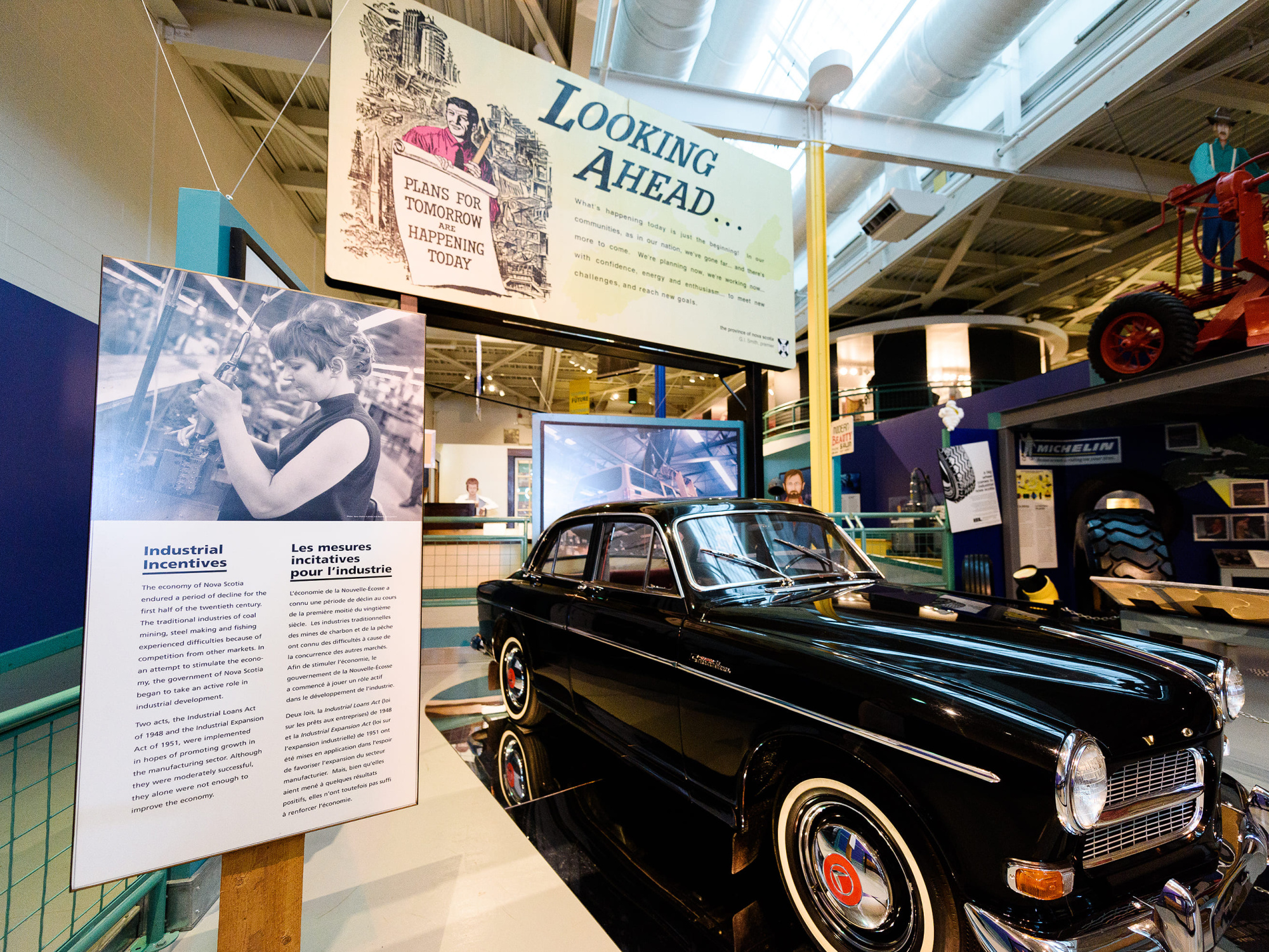 Museum exhibit displaying an antique car