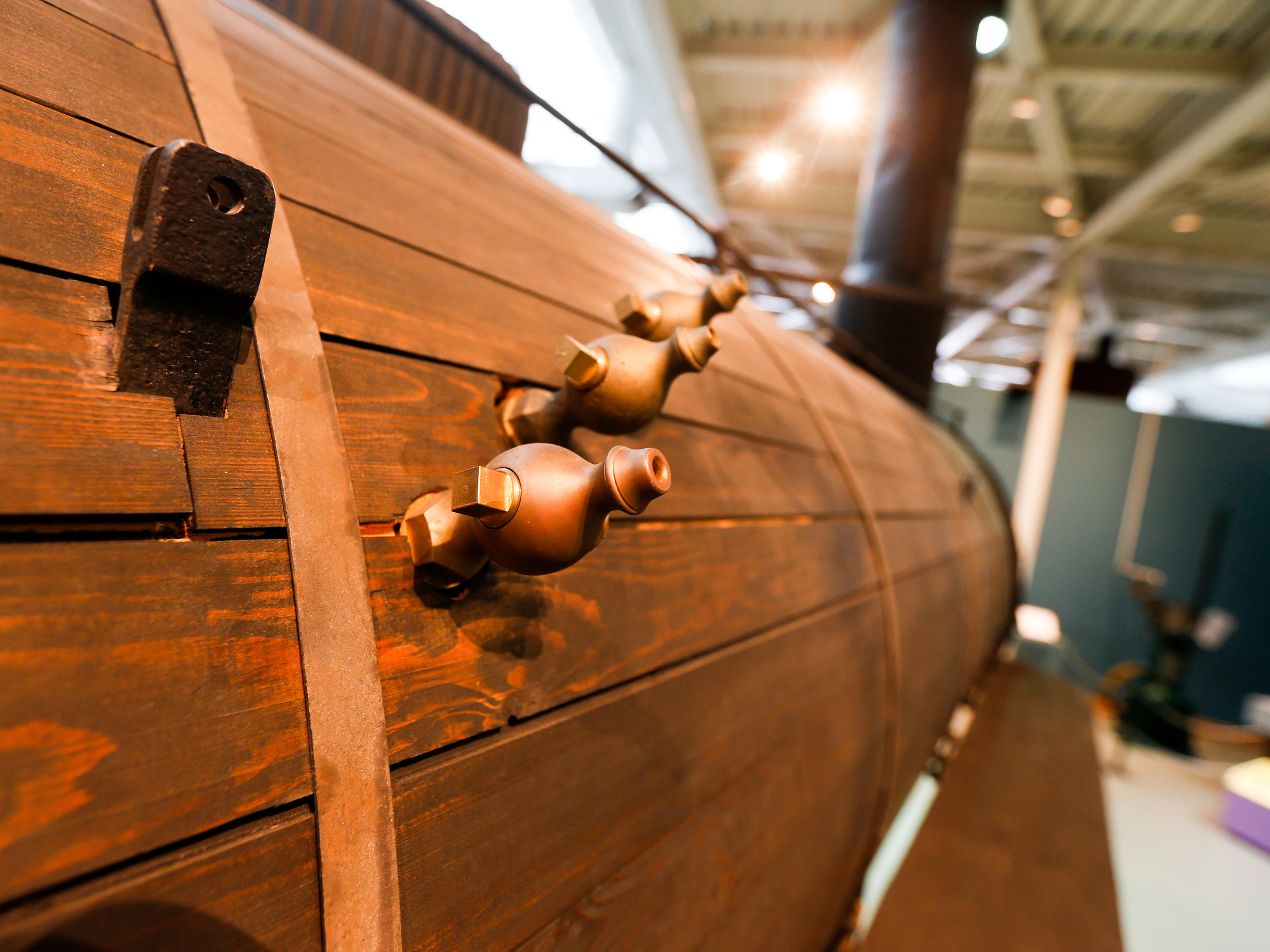 Close up image of the side of a train made of wood.