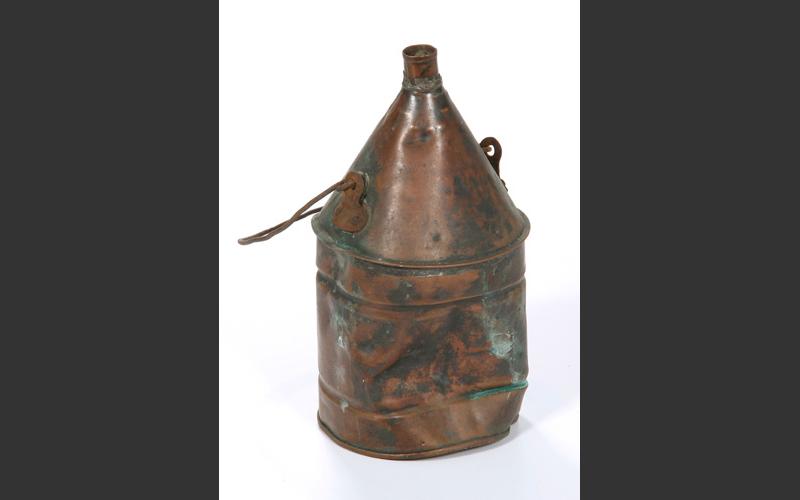 A water can, part of a lunch kit, held a miner’s drinking water.
