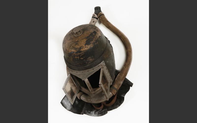 Early draegerman’s helmet with breathing hoses attached.