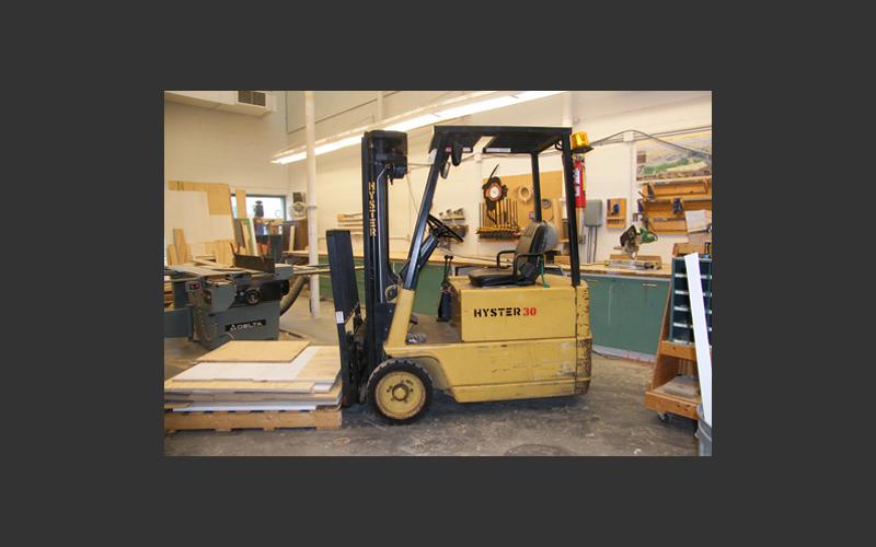 Our little yellow forklift can lift up to 3000 pounds