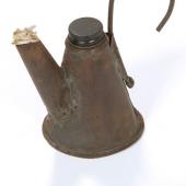 Bicket Lamp: a small oil burning lamp hooked onto the front of a miner’s cap to light his work.