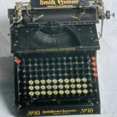 A Smith Premier No. 10 manual typewriter with full keyboard. The black keys type uppercase and the white keys type lowercase letters. This model was introduced in 1908 and was the primary tool for clerical work. Not currently on display
