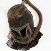Early draegerman’s helmet with breathing hoses attached.