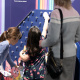 Girls explore an interactive station in the Mighty Engine exhibit.