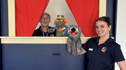 Staff using a Puppet Theater.